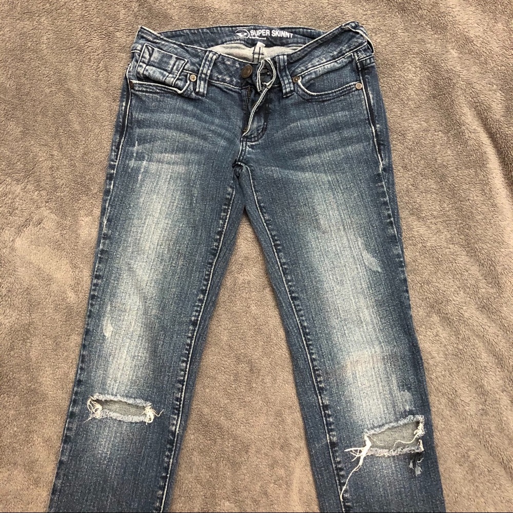 Jeans with holes at knee